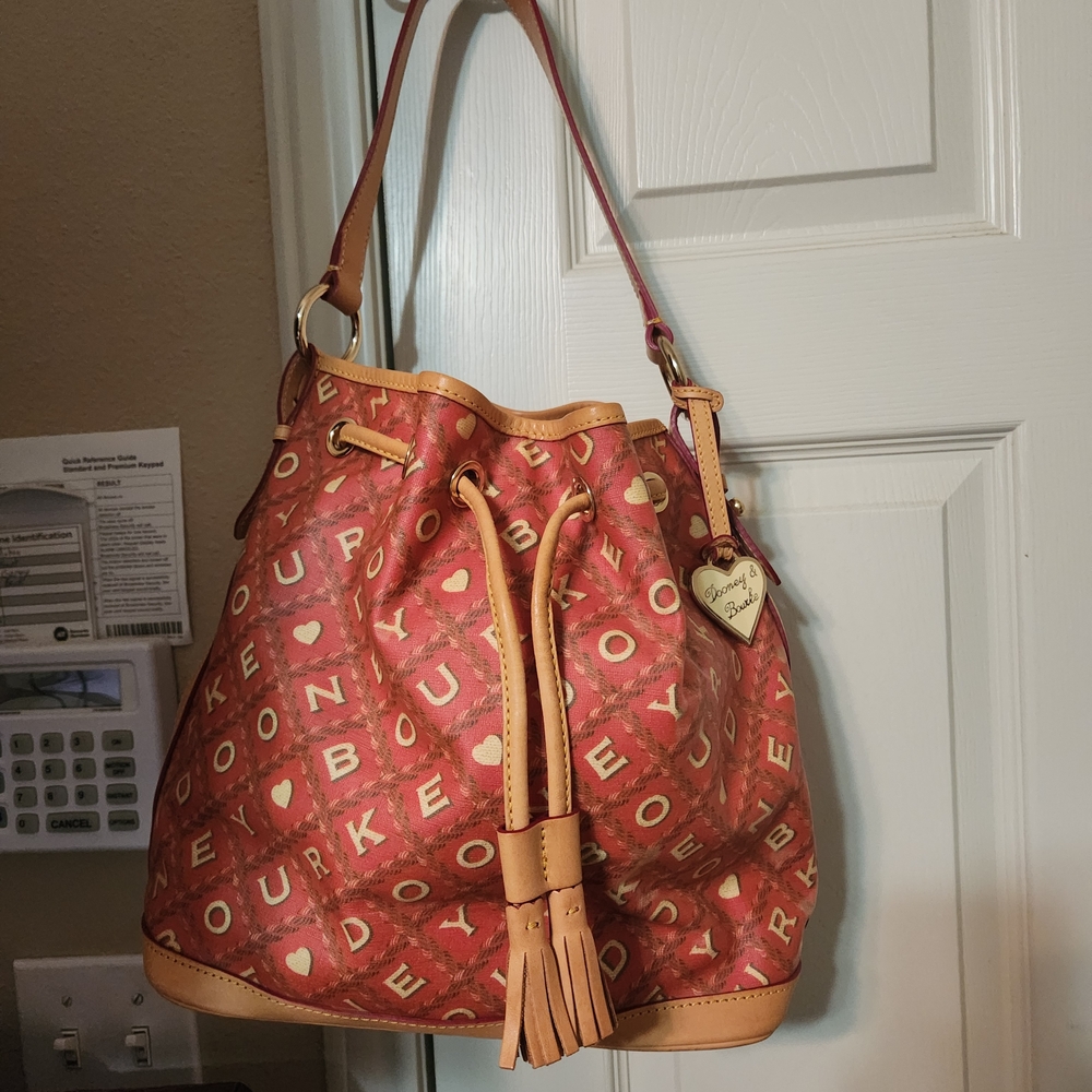 Dooney & Bourke Salmon Canvas Crossword Bucket Bag